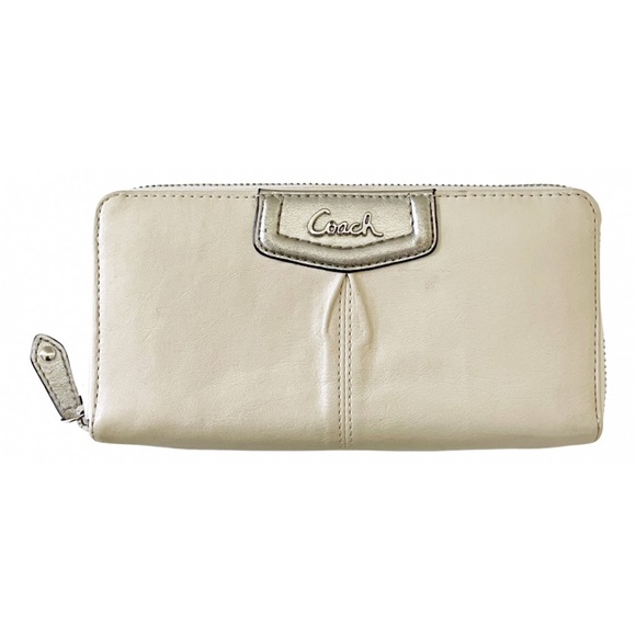 Coach Handbags - Coach off white and silver leather long zip wallet